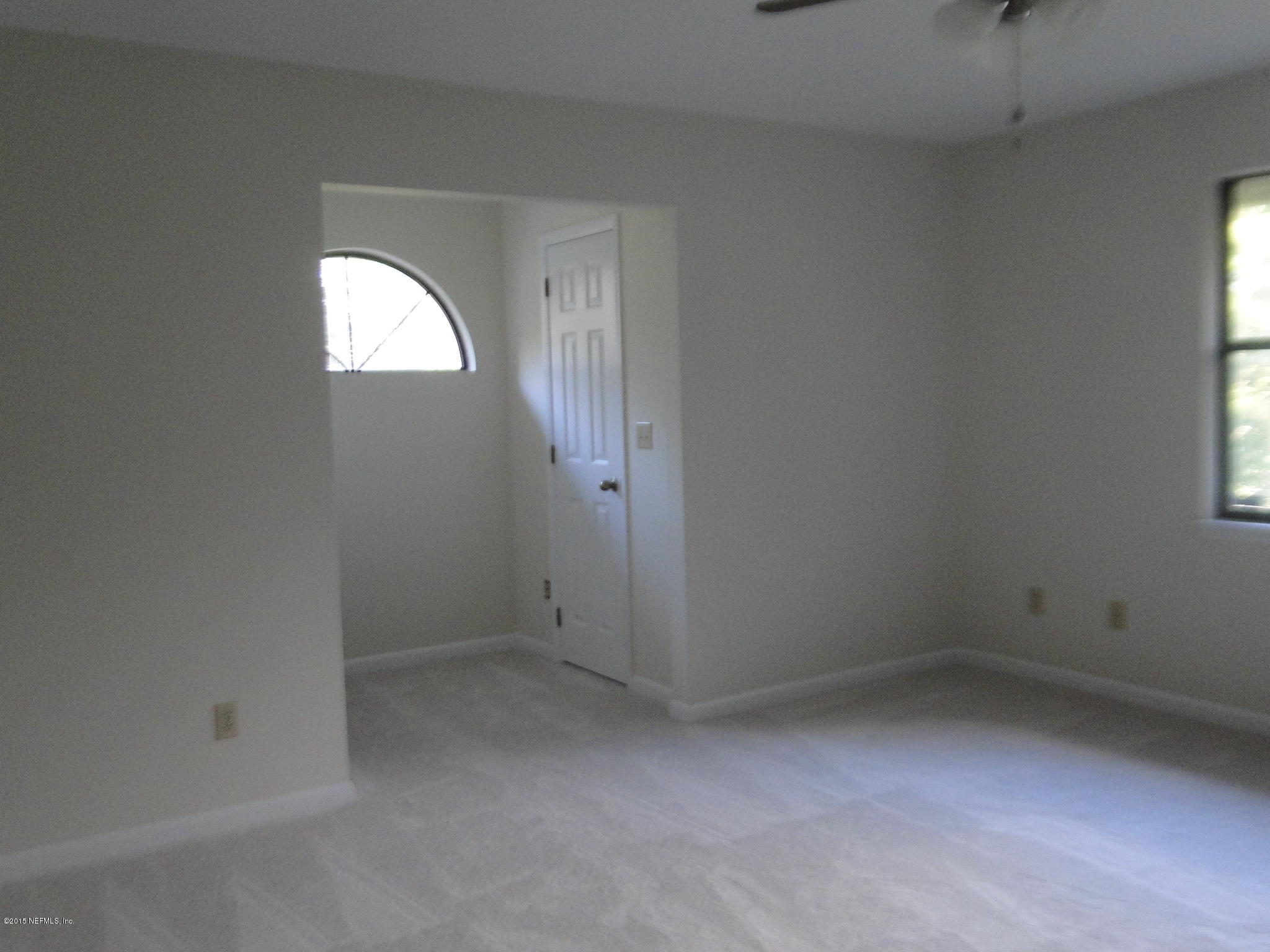 5496 Spring Brook Road Jacksonville, FL 32277 - Photo 18 of 25 an empty room with windows