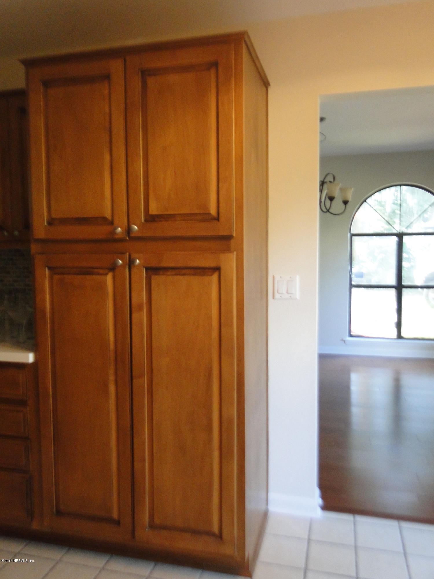 5496 Spring Brook Road Jacksonville, FL 32277 - Photo 9 of 25 wooden floor and windows in a room