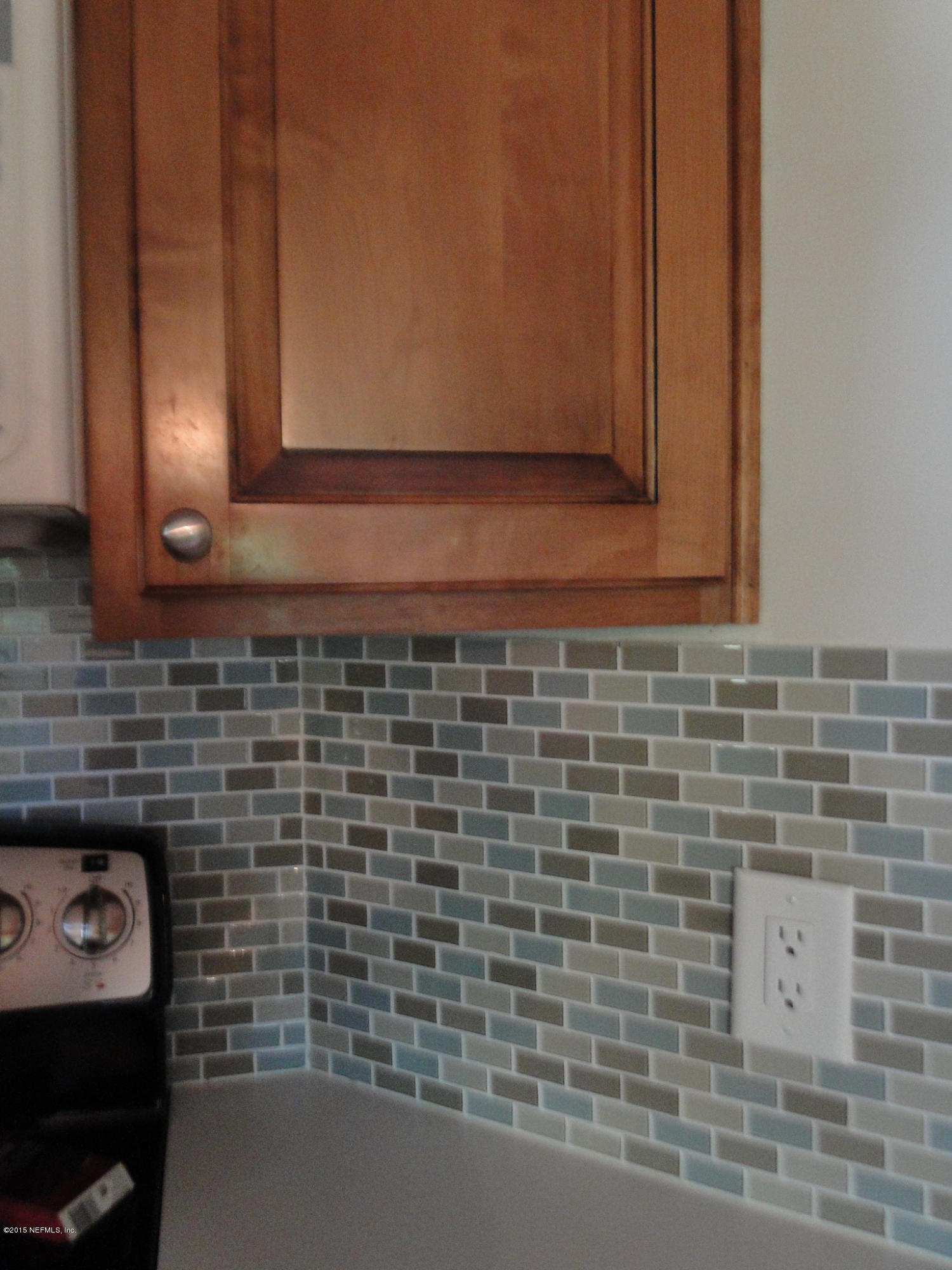 5496 Spring Brook Road Jacksonville, FL 32277 - Photo 10 of 25 a bathroom with a sink and a mirror