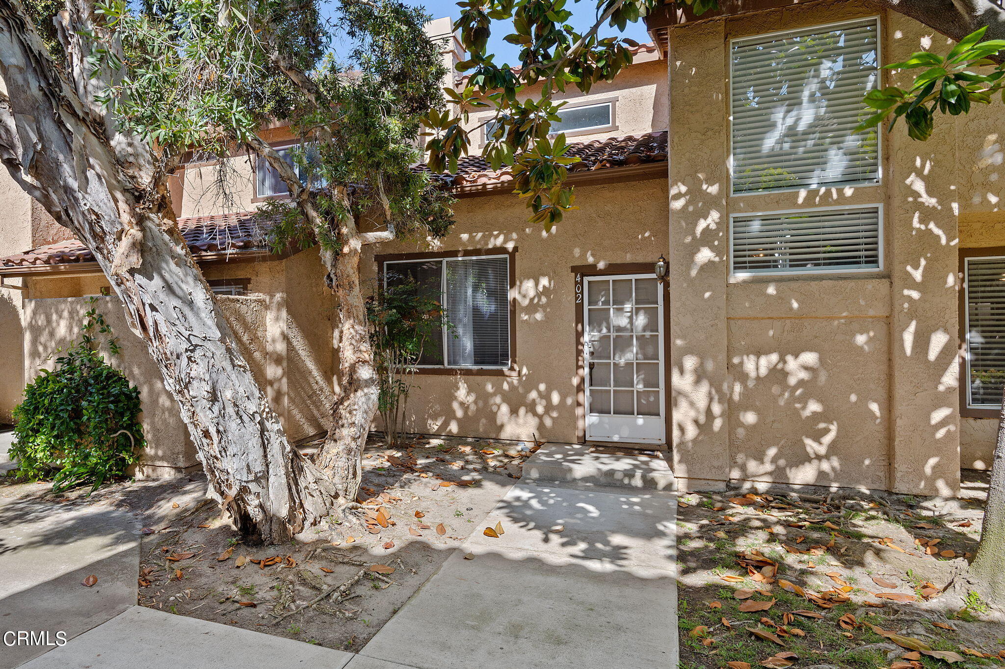402 Johnson Road Oxnard, CA 93033 - Photo 1 of 18 a view of a building with a tree
