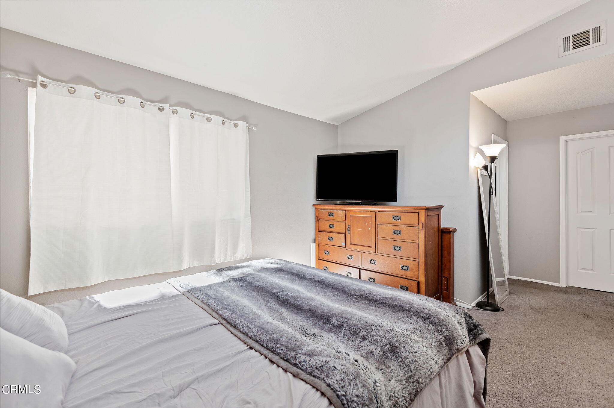 402 Johnson Road Oxnard, CA 93033 - Photo 11 of 18 a bedroom with a bed and a flat screen tv