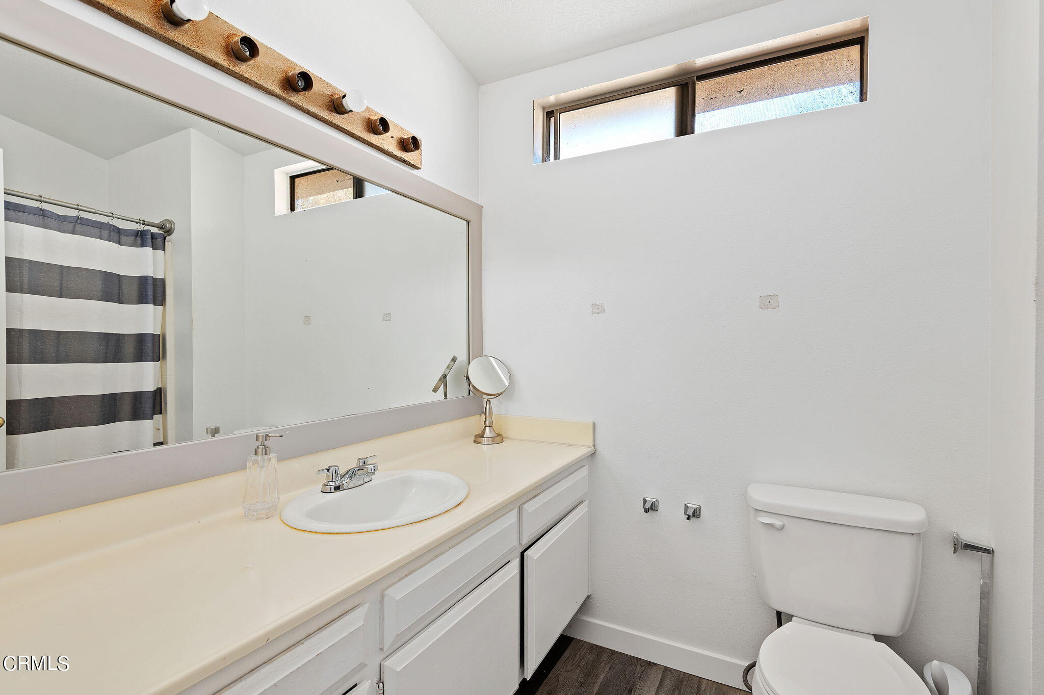 402 Johnson Road Oxnard, CA 93033 - Photo 12 of 18 a bathroom with a sink toilet and mirror