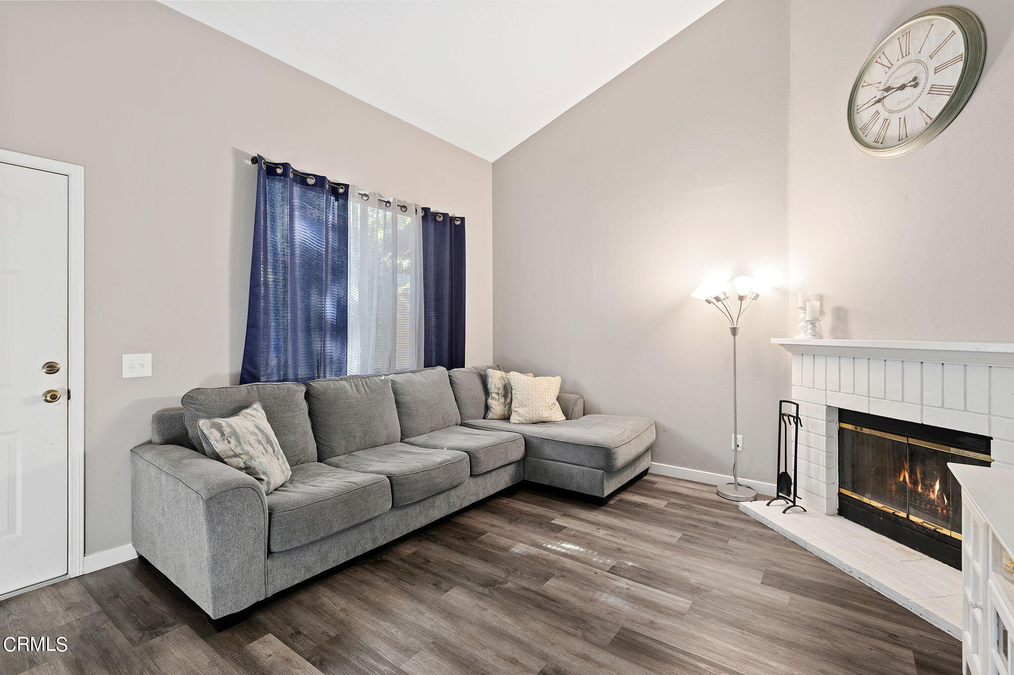 402 Johnson Road Oxnard, CA 93033 - Photo 4 of 18 a living room with furniture and a fireplace