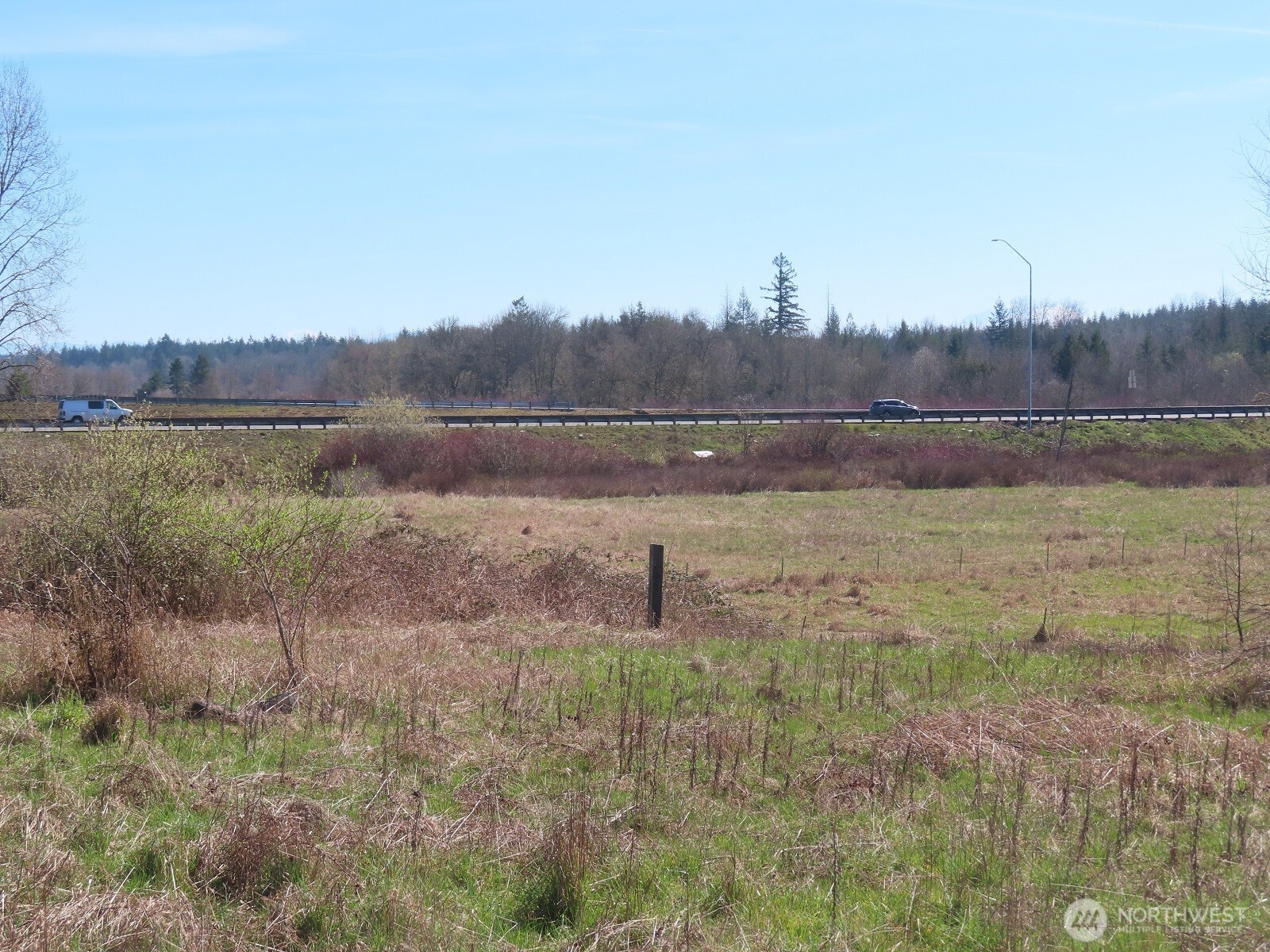 107 West Avery Road Napavine, WA 98532 - Photo 2 of 33 a view of a lake with a yard and large trees
