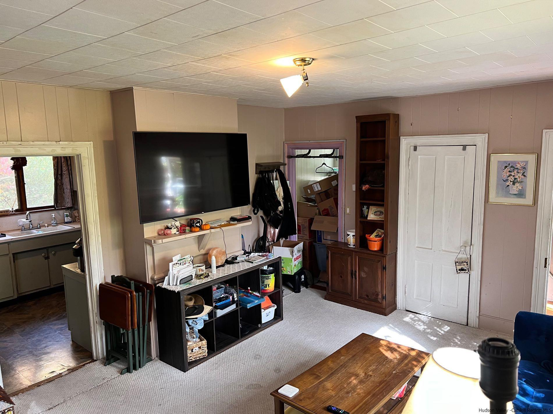87 Dewitt Street Kingston, NY 12401 - Photo 14 of 33 a living room with furniture and a flat screen tv