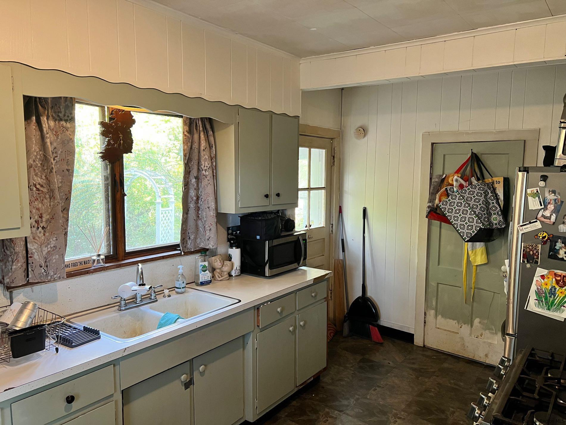 87 Dewitt Street Kingston, NY 12401 - Photo 19 of 33 a bathroom with a double vanity sink a mirror and next to a window