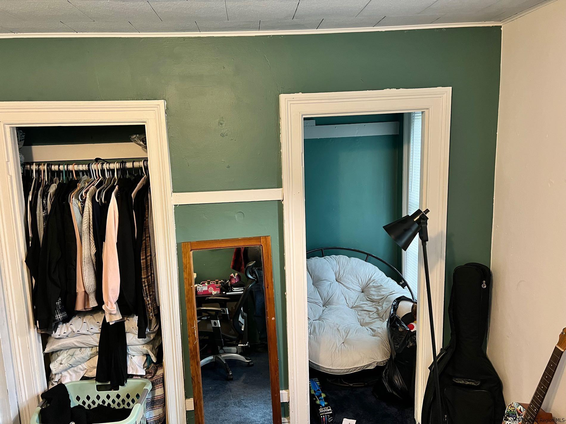 87 Dewitt Street Kingston, NY 12401 - Photo 26 of 33 a view of walk in closet with clothes and shoes