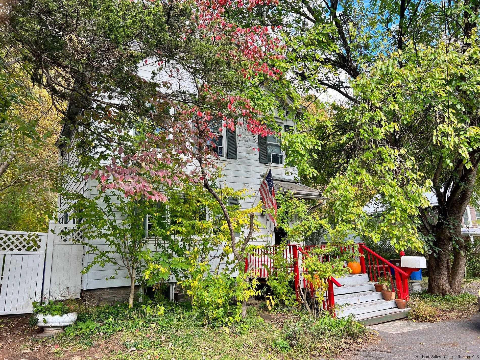 87 Dewitt Street Kingston, NY 12401 - Photo 3 of 33 a backyard of a house with lots of green space