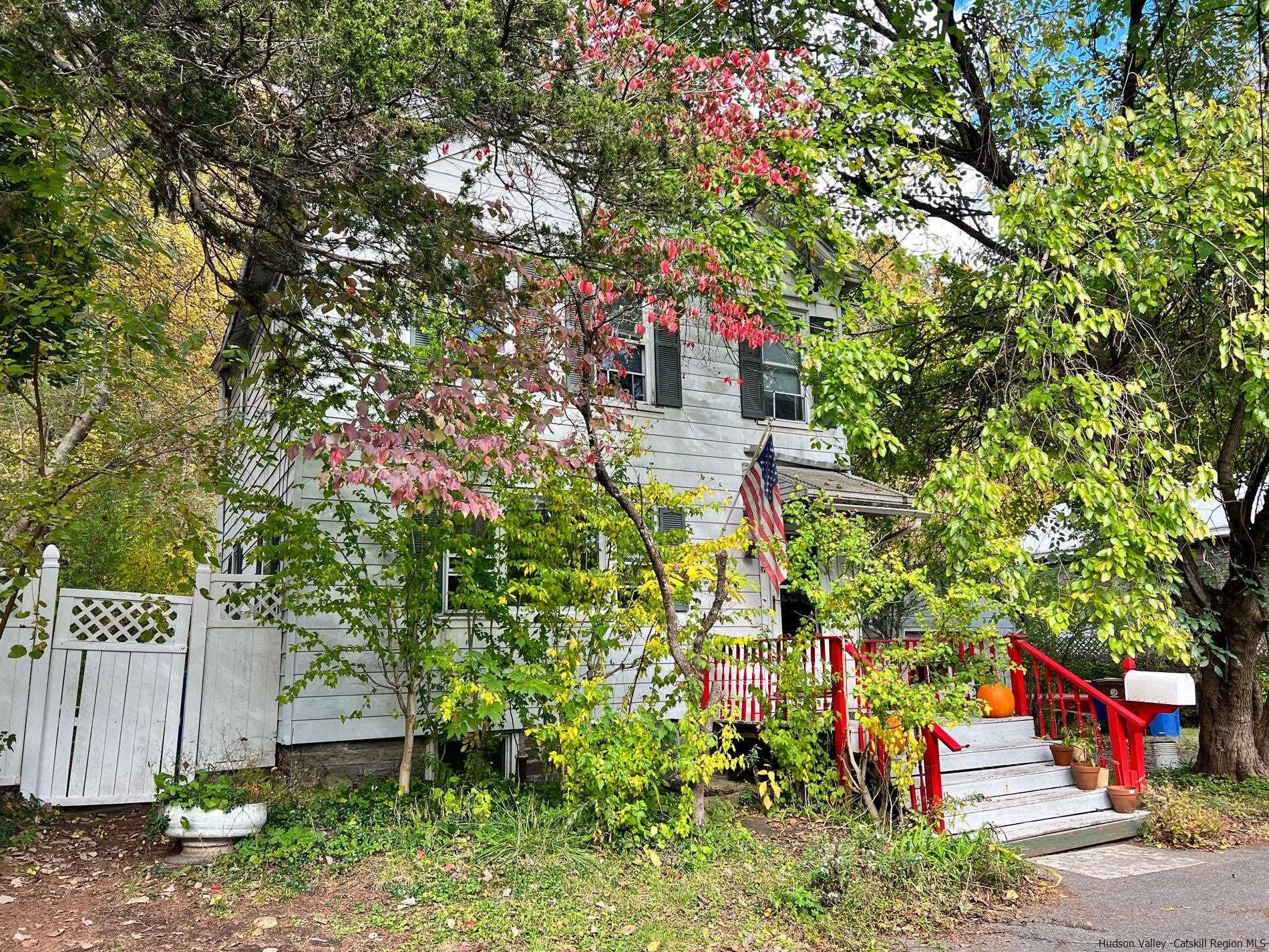 87 Dewitt Street Kingston, NY 12401 - Photo 5 of 33 a backyard of a house with lots of green space