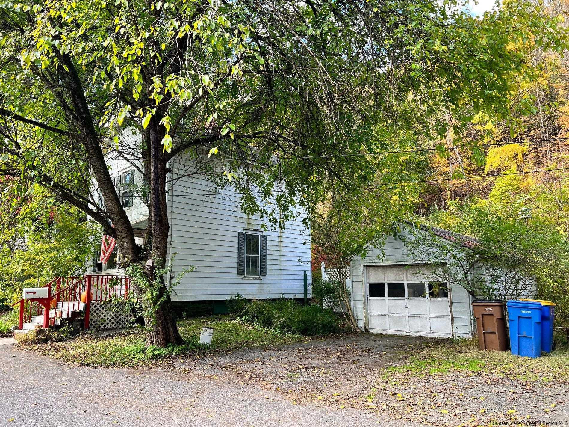 87 Dewitt Street Kingston, NY 12401 - Photo 6 of 33 a front view of a house with a garden