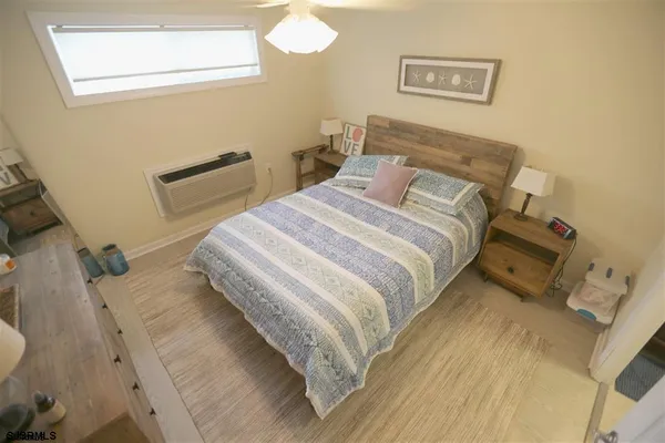 a bedroom with a bed and cabinets