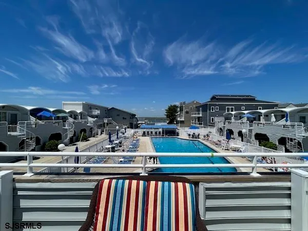 a bed room with two beds and painting on the wall