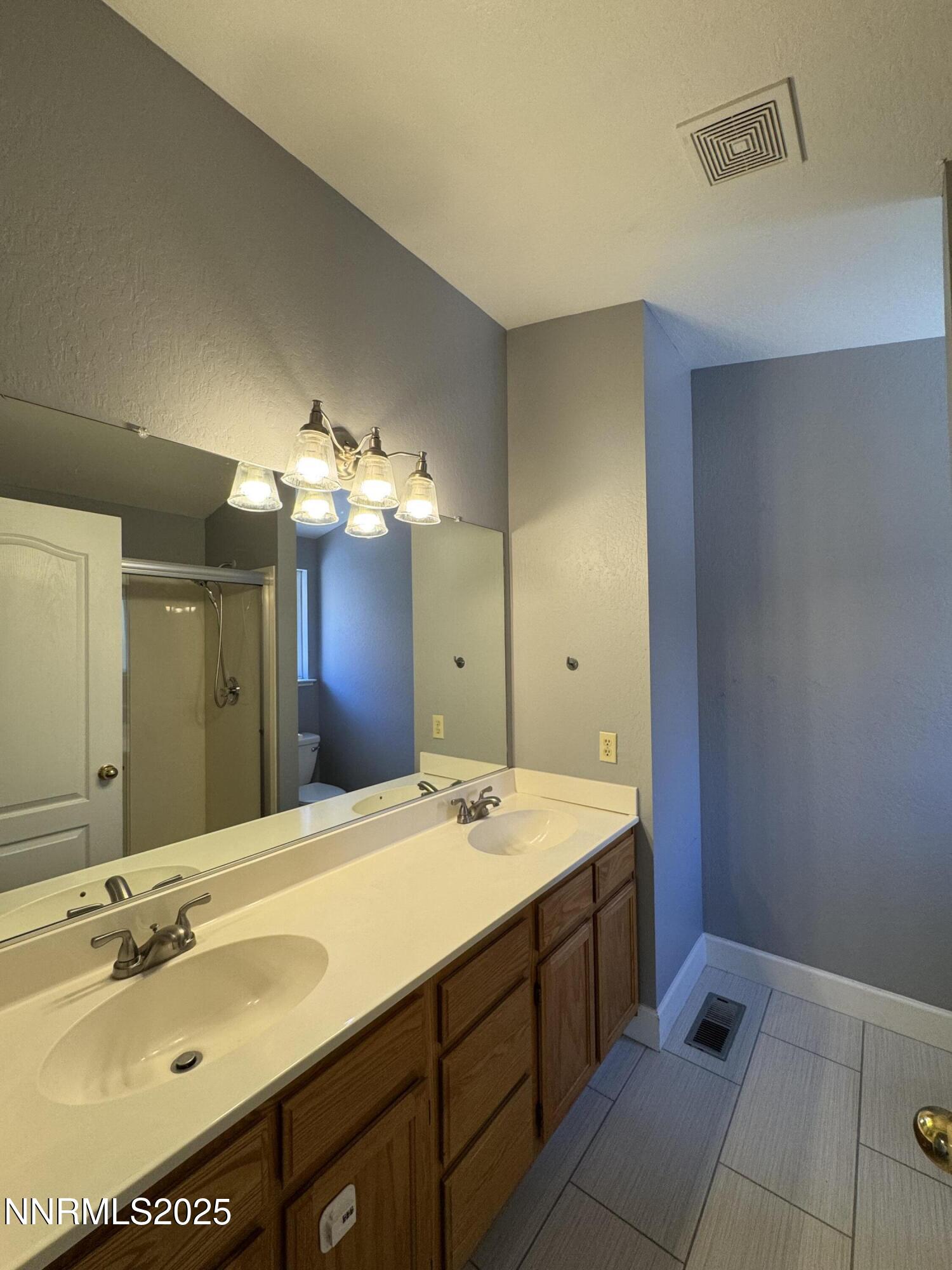 6559 Fall River Circle Reno, NV 89523 - Photo 16 of 35 a bathroom with a sink and a mirror