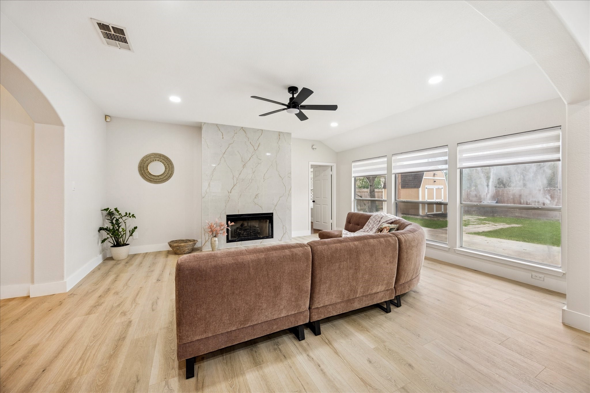 12624 Twisted Briar Lane Austin, TX 78729 - Photo 11 of 41 a living room with furniture and a floor to ceiling window