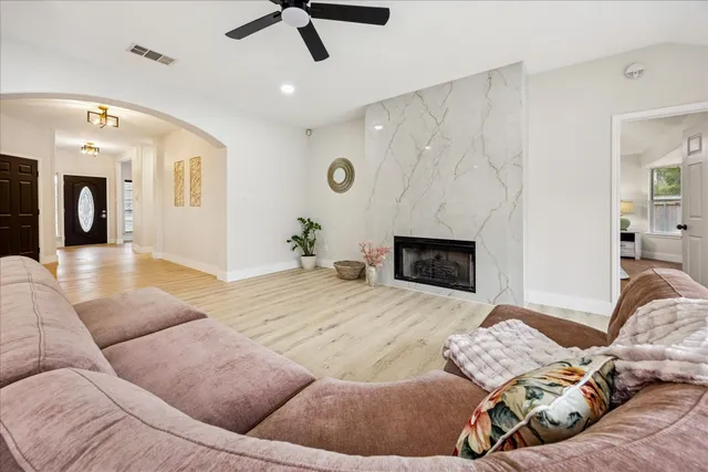 a living room with furniture and a fireplace