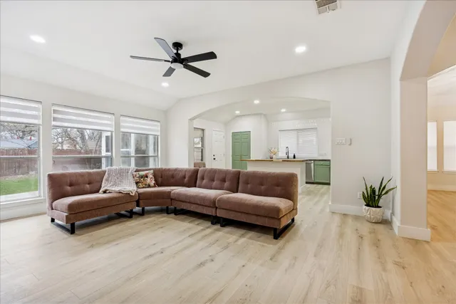 a living room with furniture and a large window