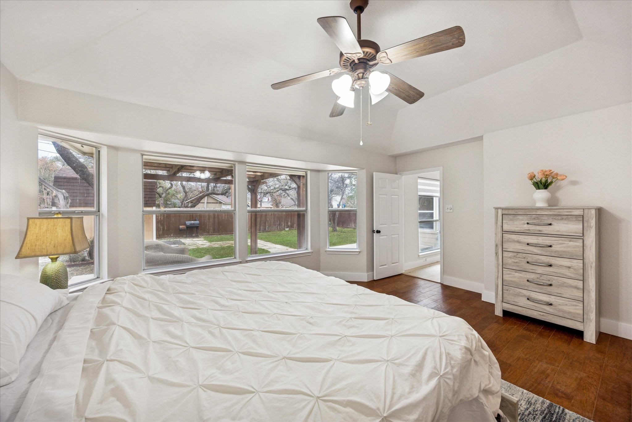 12624 Twisted Briar Lane Austin, TX 78729 - Photo 23 of 41 a bedroom with a large bed and a large window