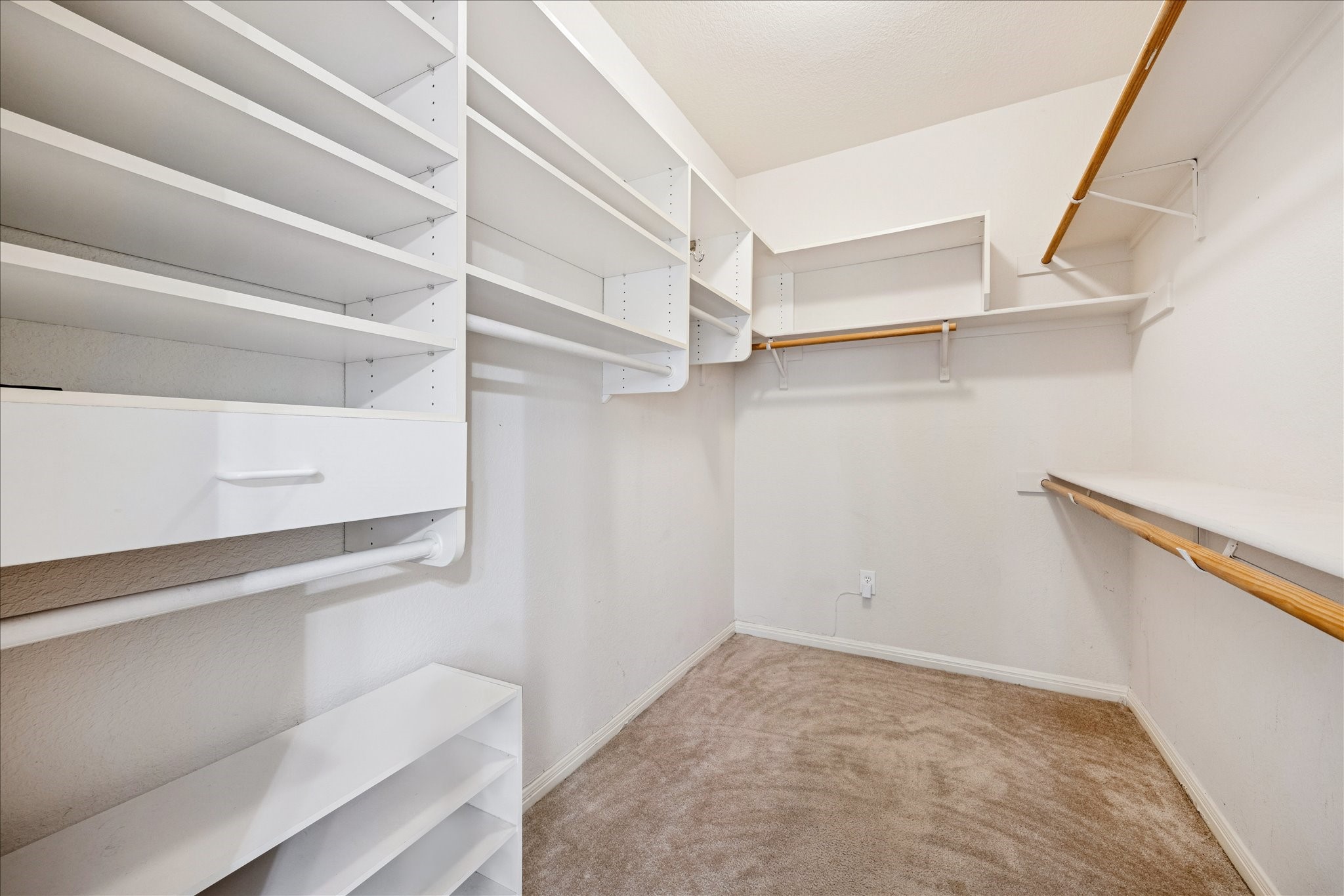12624 Twisted Briar Lane Austin, TX 78729 - Photo 26 of 41 a view of walk in closet with empty racks