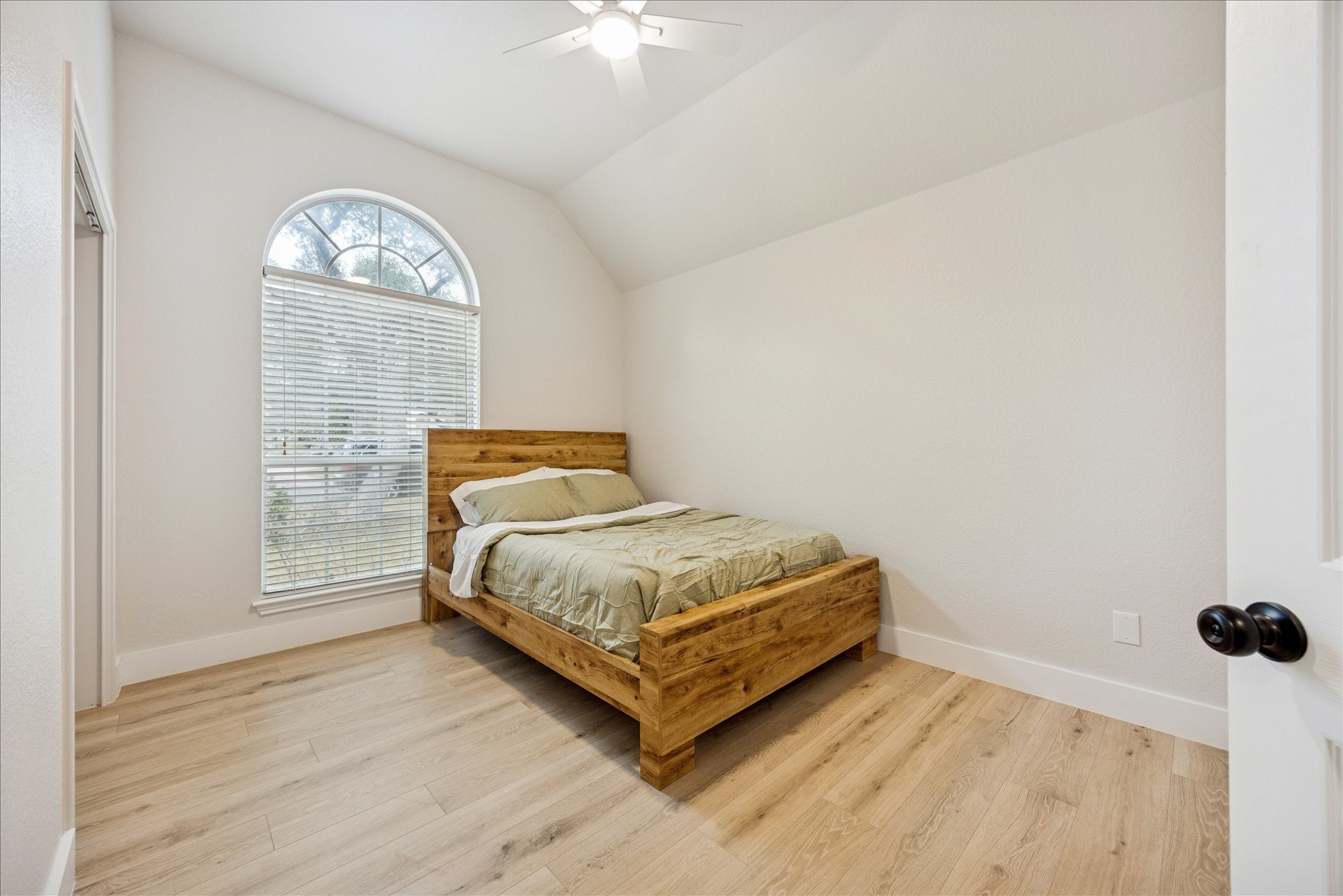 12624 Twisted Briar Lane Austin, TX 78729 - Photo 27 of 41 a bedroom with a bed and a table
