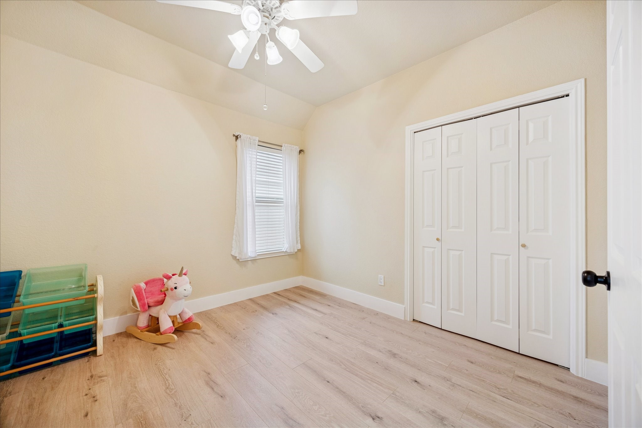 12624 Twisted Briar Lane Austin, TX 78729 - Photo 29 of 41 wooden floor in an empty room with a window