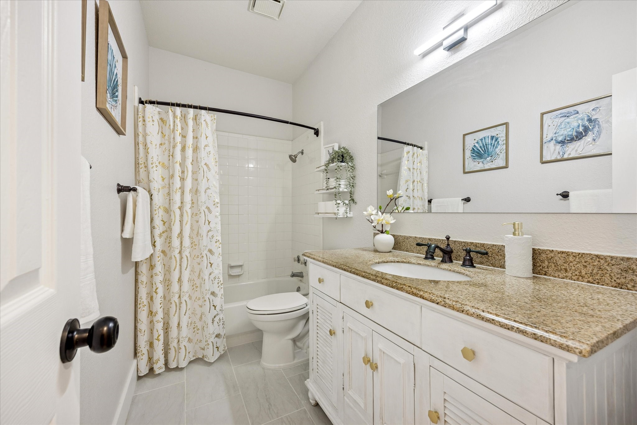 12624 Twisted Briar Lane Austin, TX 78729 - Photo 31 of 41 a bathroom with a granite countertop sink a toilet a mirror and shower
