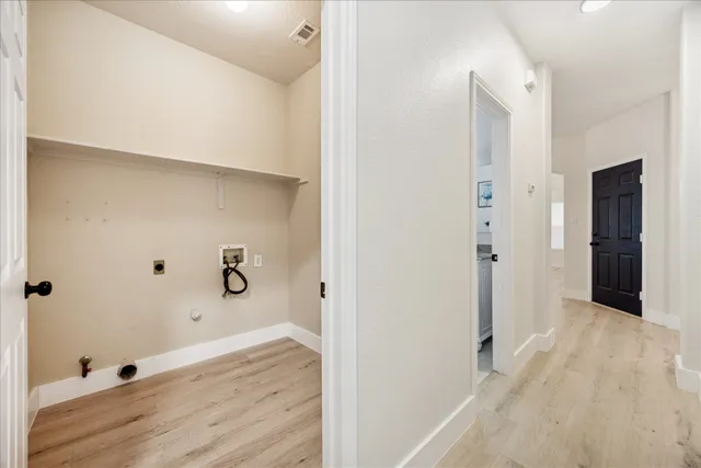 a view of a bathroom with wooden floor