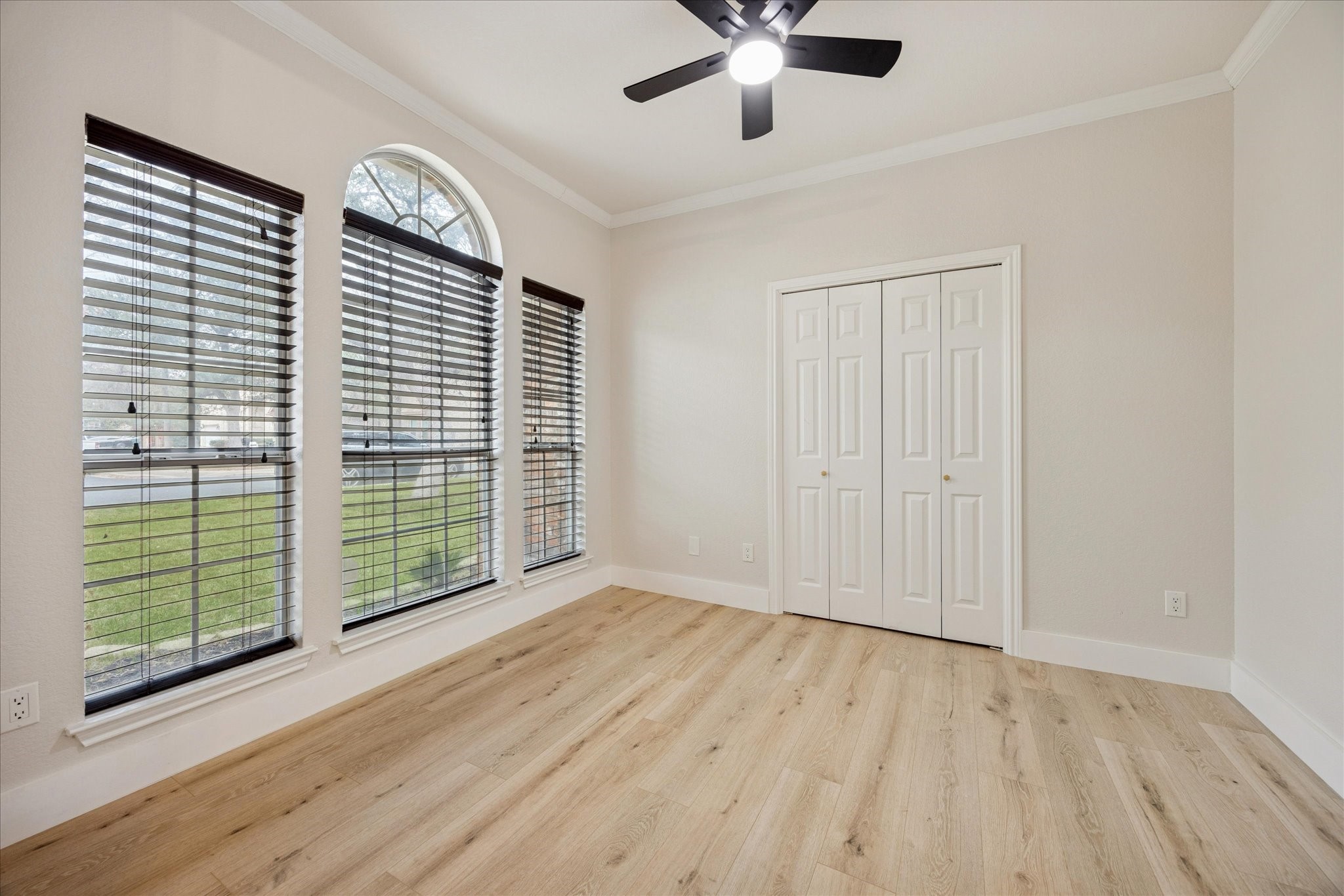 12624 Twisted Briar Lane Austin, TX 78729 - Photo 4 of 41 wooden floor in an empty room with a window