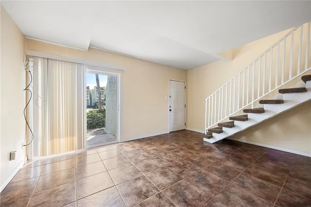 a view of an empty room with stairs