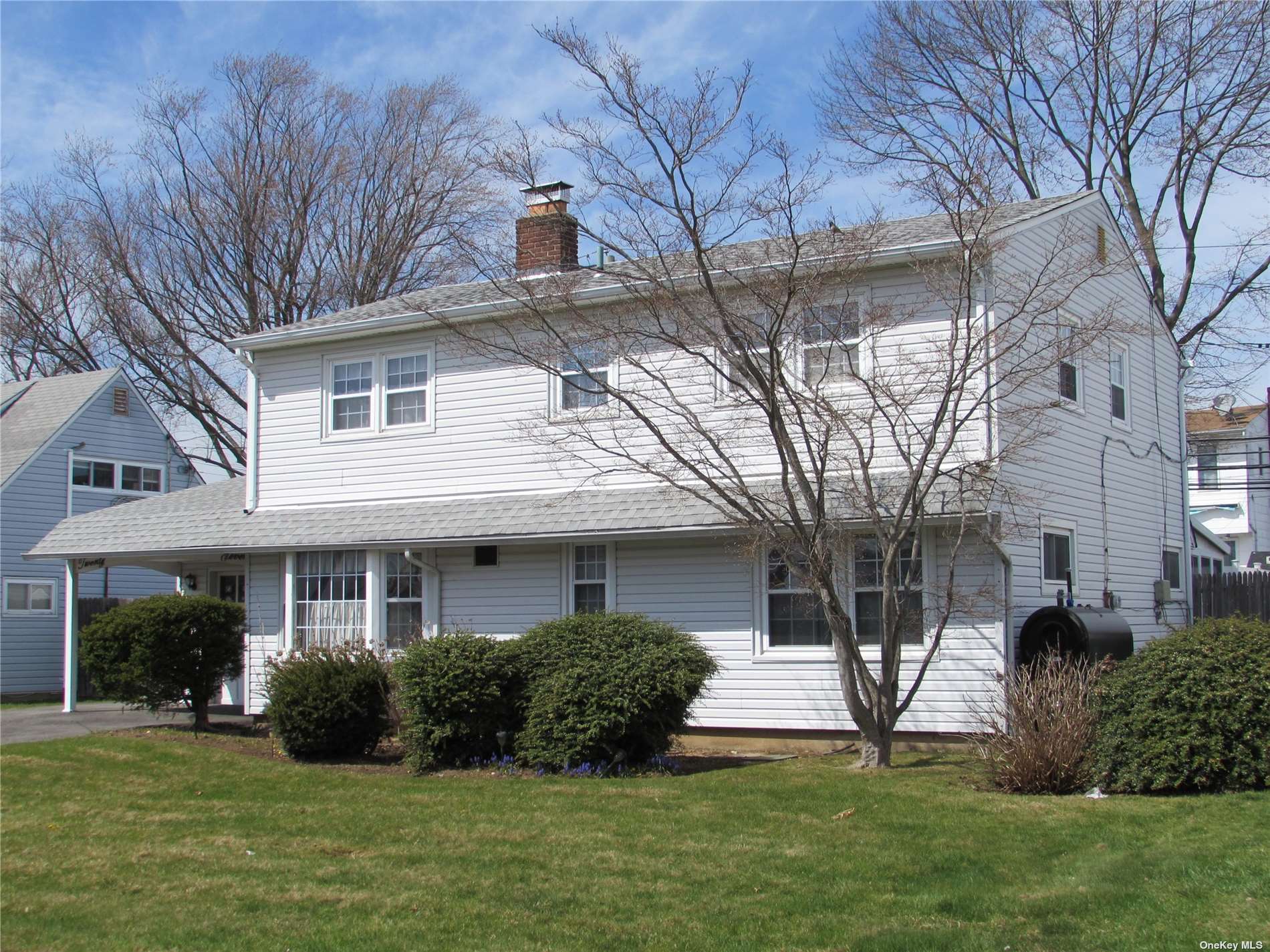 27 Friendly Road Hicksville, NY 11801 - Photo 1 of 1 a front view of a house with a yard
