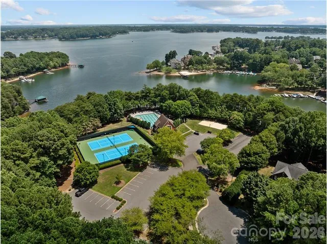 an aerial view of a house with a lake view