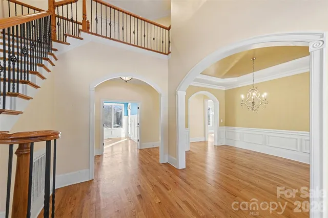 a view of an entryway with wooden floor