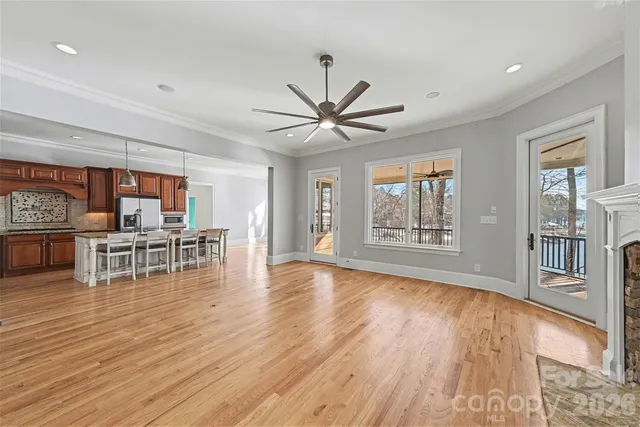 a living room with furniture and large windows