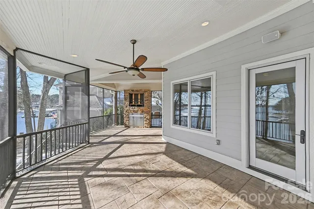 a view of a room with wooden floor and windows