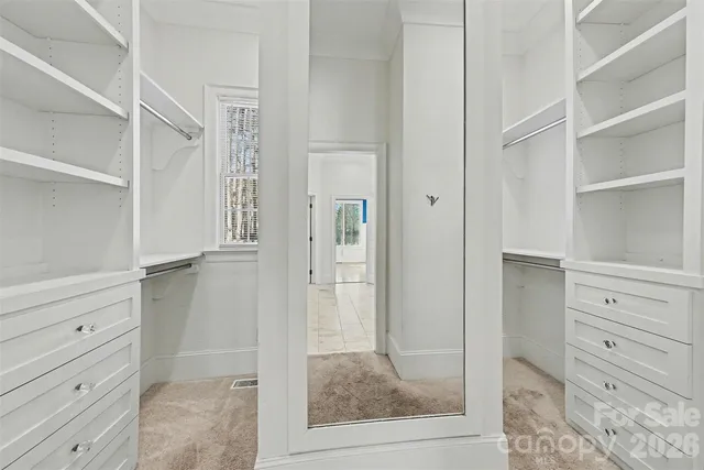 a view of wooden floor and windows in a room