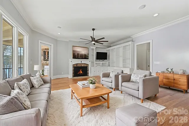 a living room with fireplace furniture and a fireplace