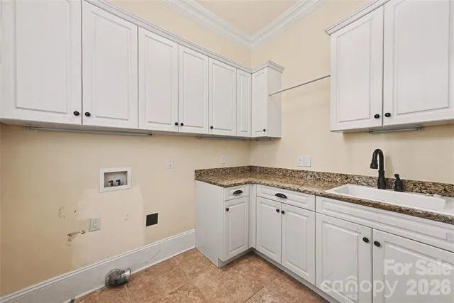 a view of a lake with outdoor seating and city view