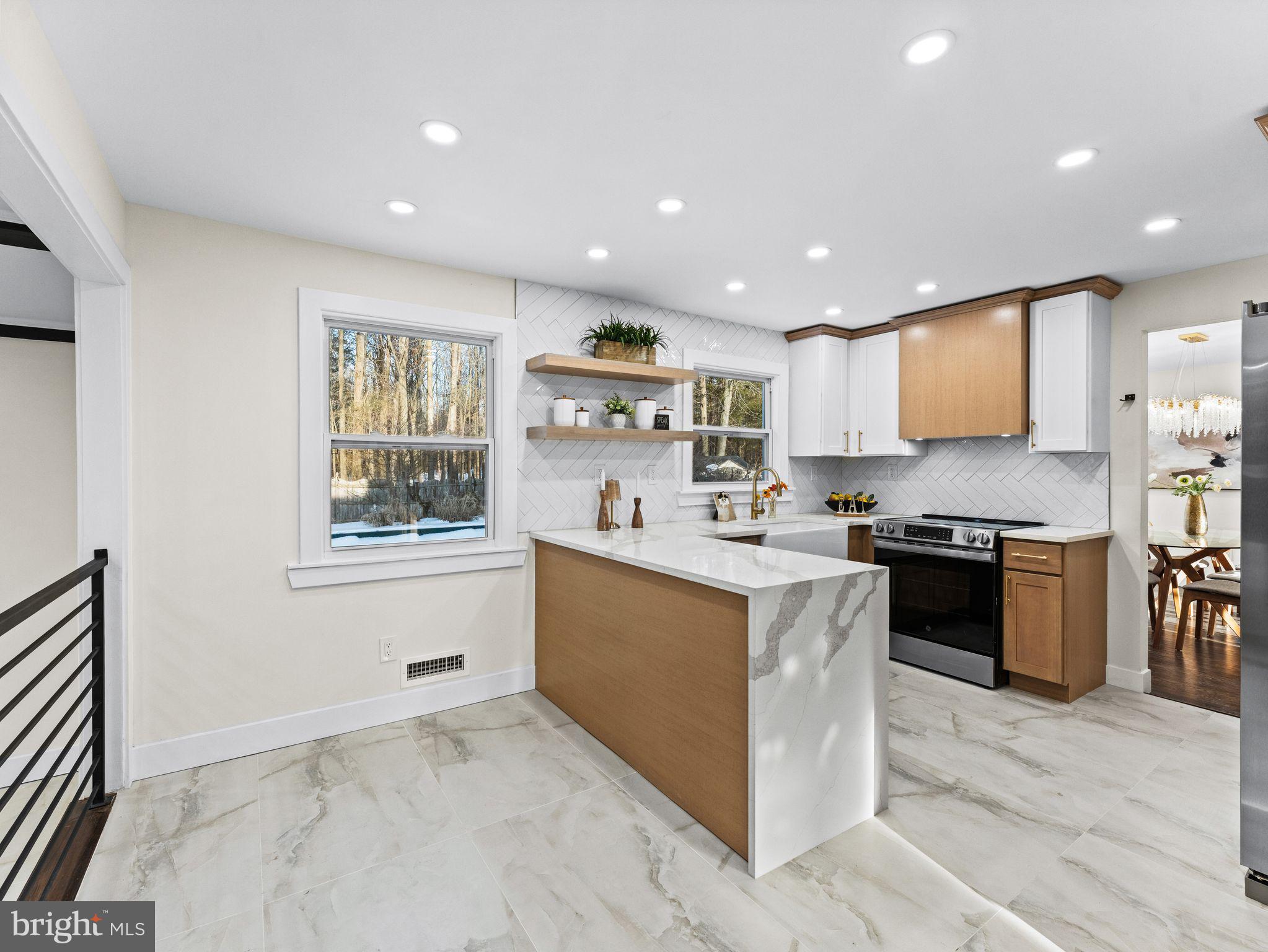 7 Charter Oak Road Clementon, NJ 08021 - Photo 13 of 48 a kitchen with stainless steel appliances kitchen island granite countertop a stove and a sink