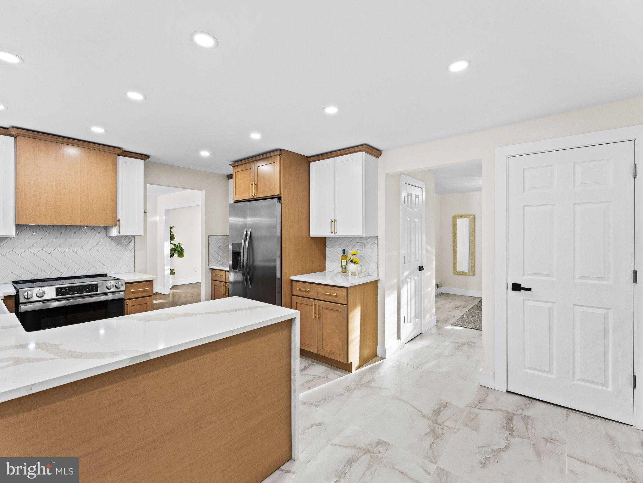 7 Charter Oak Road Clementon, NJ 08021 - Photo 14 of 48 a kitchen with a refrigerator and a stove top oven