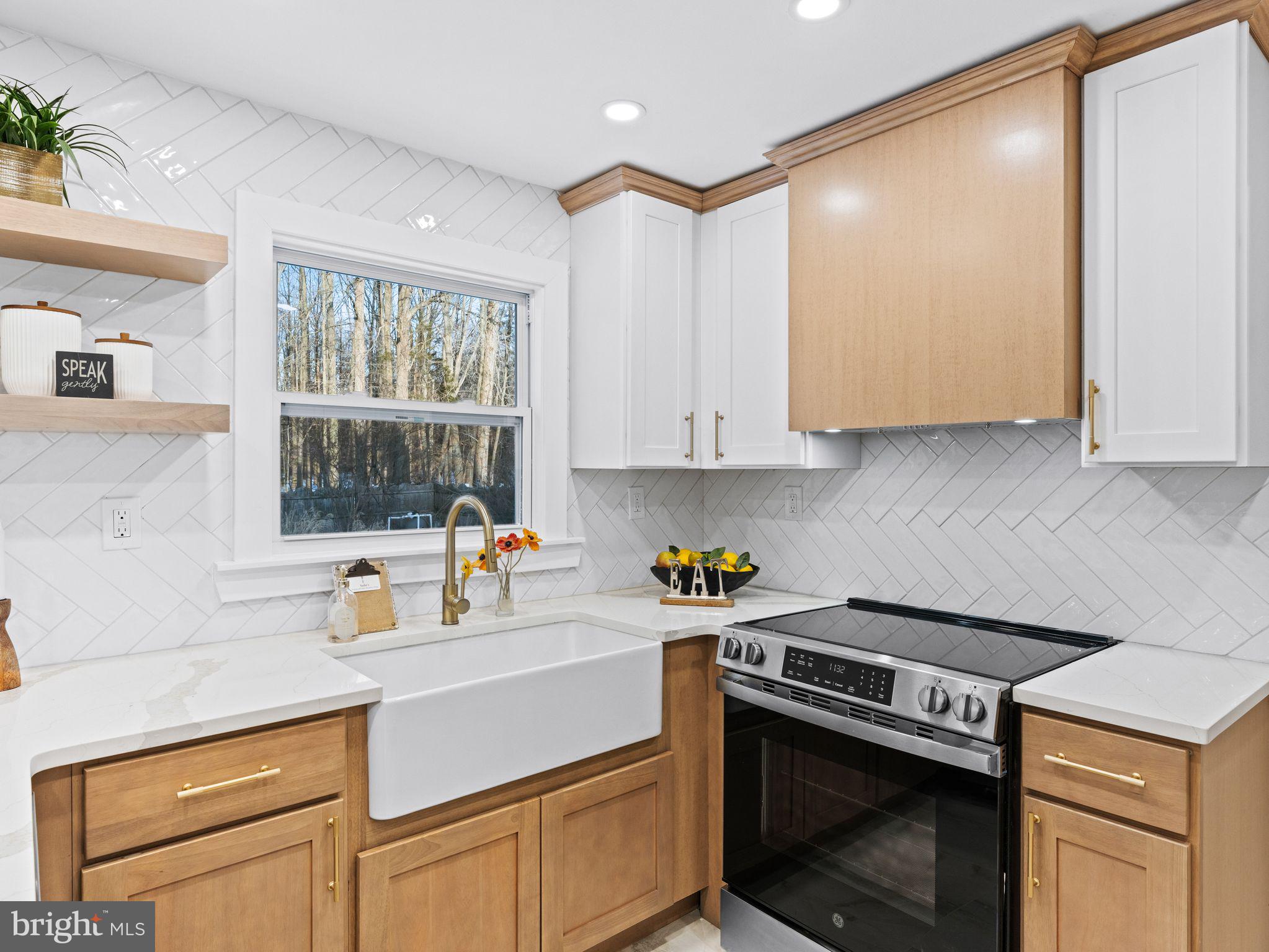 7 Charter Oak Road Clementon, NJ 08021 - Photo 17 of 48 a kitchen with a stove and white cabinets