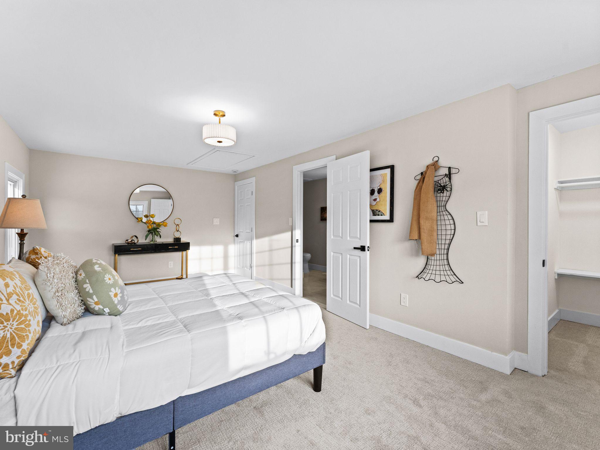 7 Charter Oak Road Clementon, NJ 08021 - Photo 25 of 48 a bedroom with a bed and a chandelier