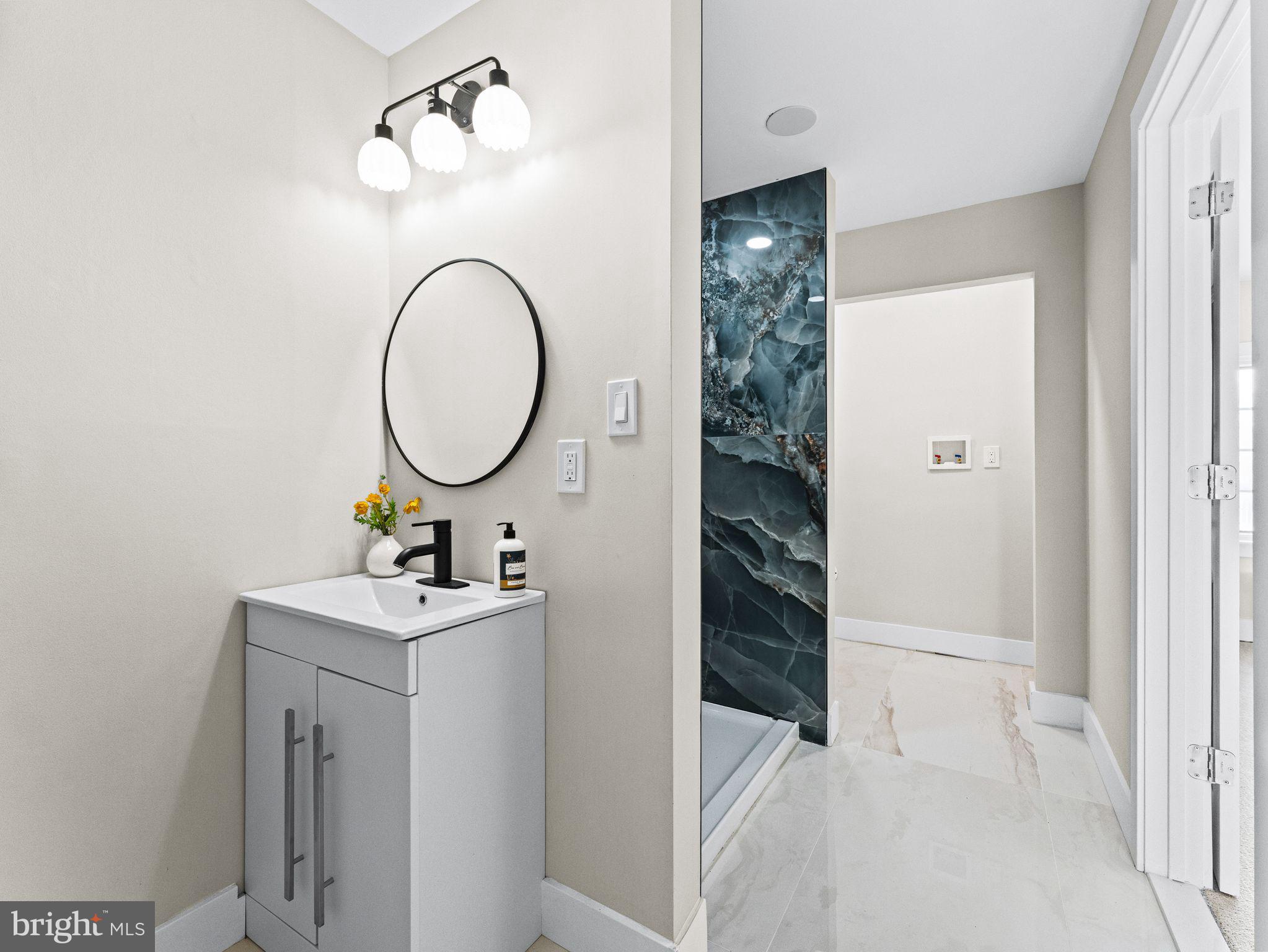 7 Charter Oak Road Clementon, NJ 08021 - Photo 28 of 48 a bathroom with a sink and a mirror