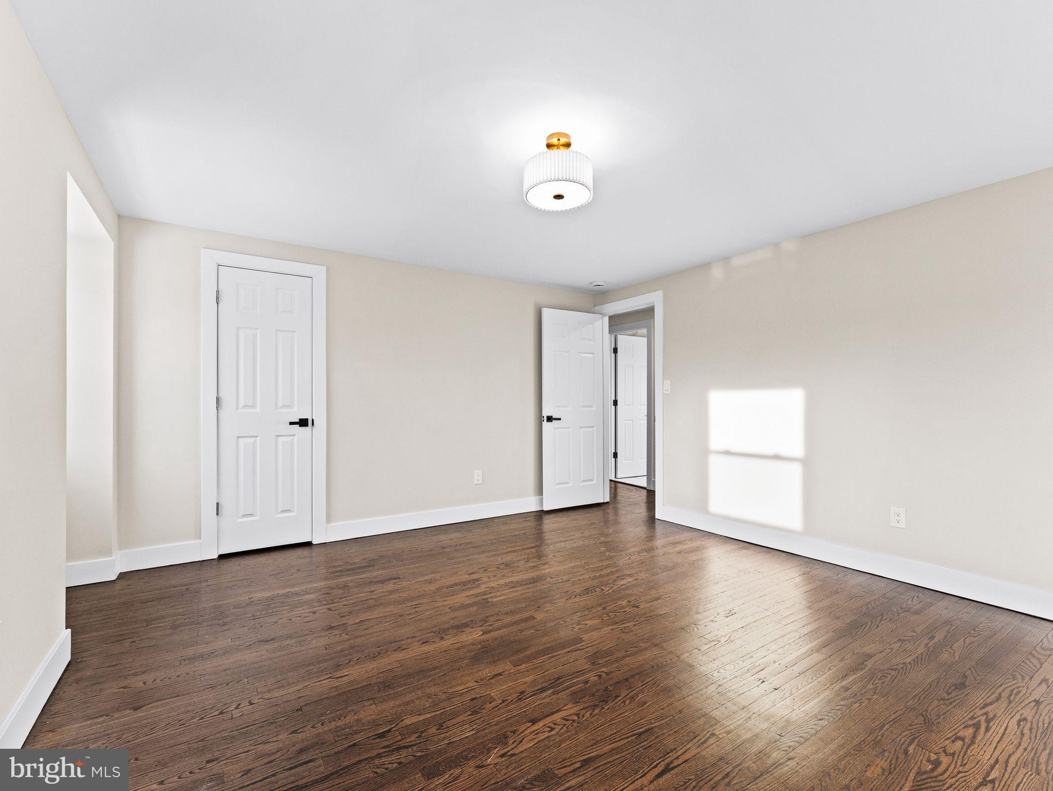 7 Charter Oak Road Clementon, NJ 08021 - Photo 31 of 48 a view of an empty room with wooden floor and a window