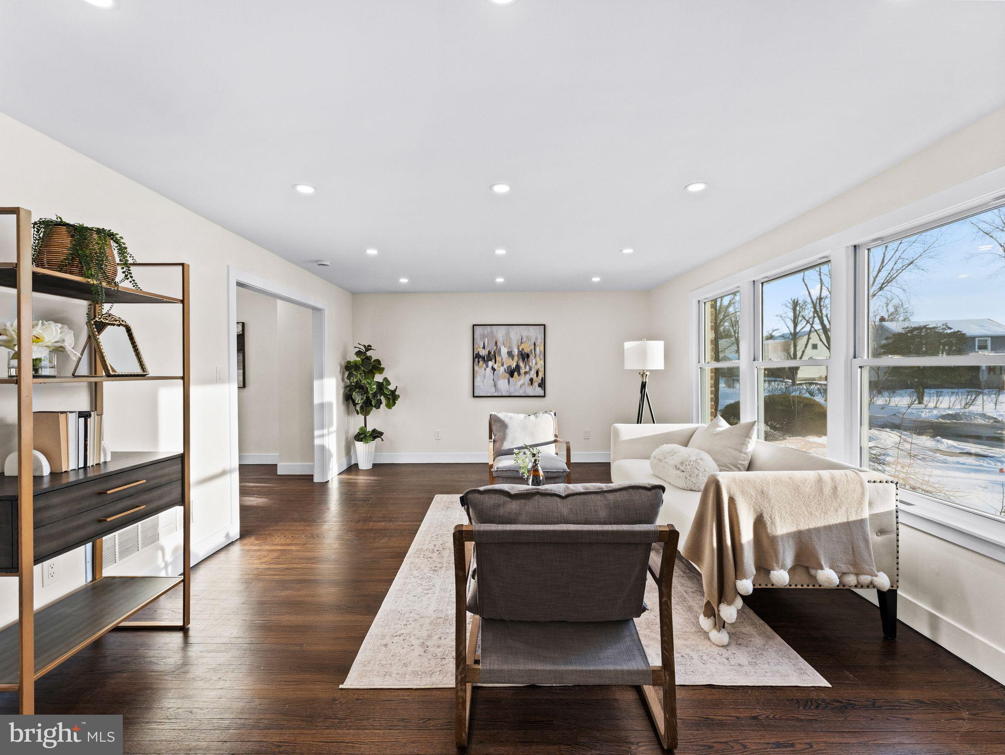 7 Charter Oak Road Clementon, NJ 08021 - Photo 7 of 48 a living room with furniture a wooden floor and a large window