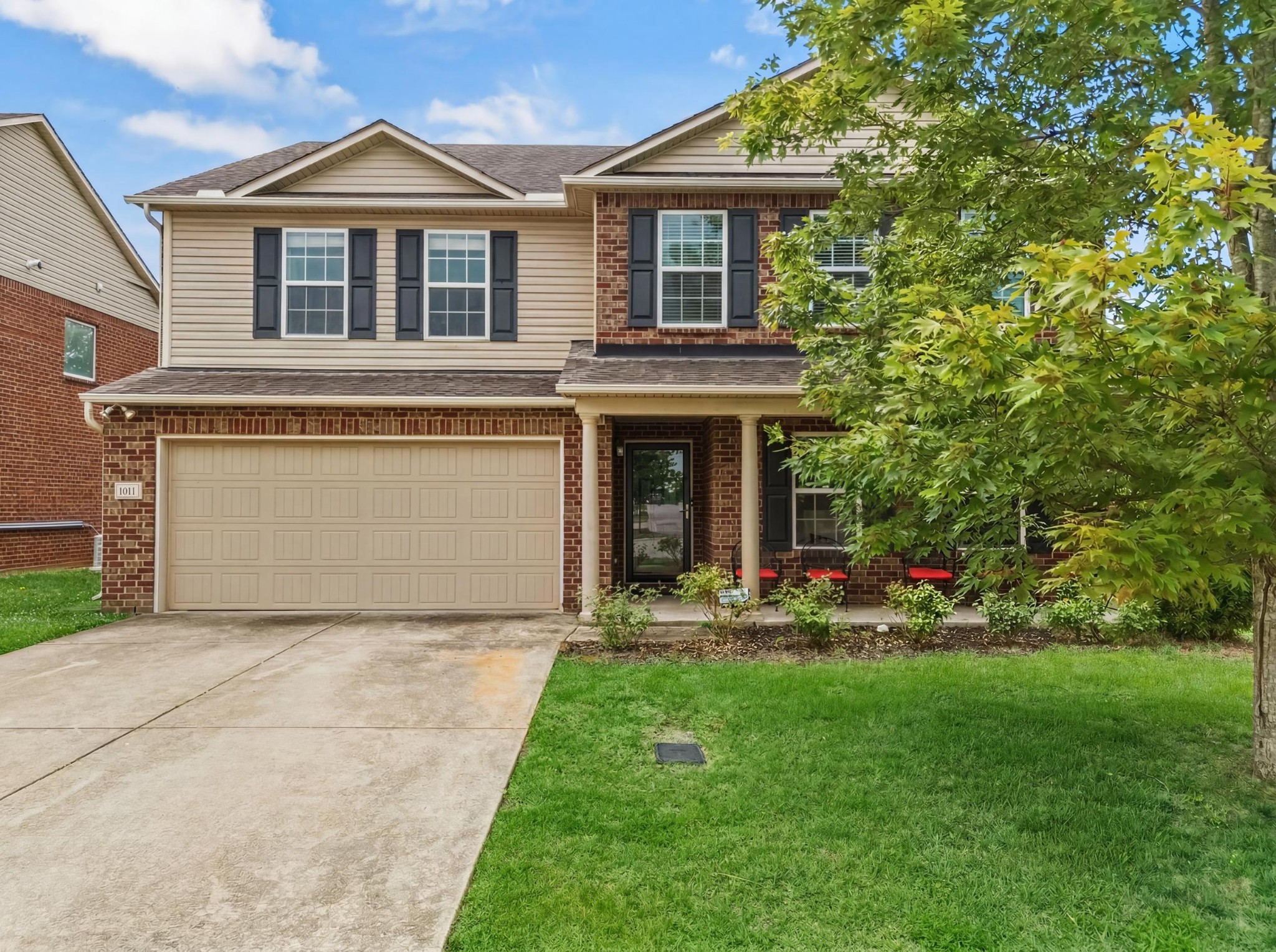 1011 Benwick Road Hendersonville, TN 37075 - Photo 6 of 60 a front view of a house with a yard and trees