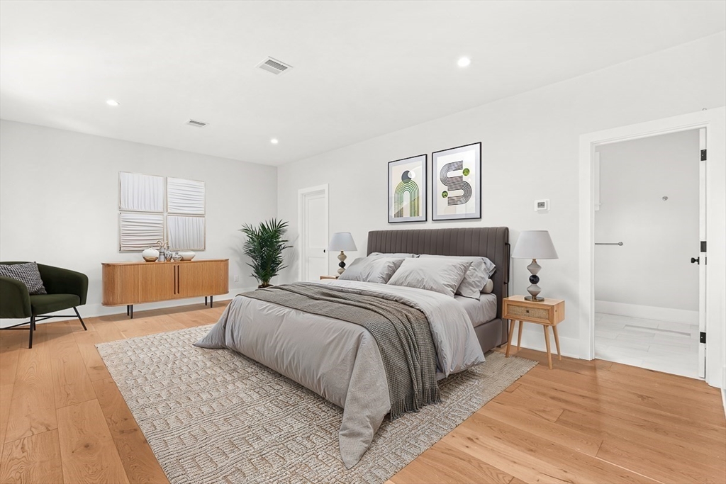 65 Summer Street, Unit 1 Natick, MA 01760 - Photo 11 of 21 a spacious bedroom with a large bed and a couch