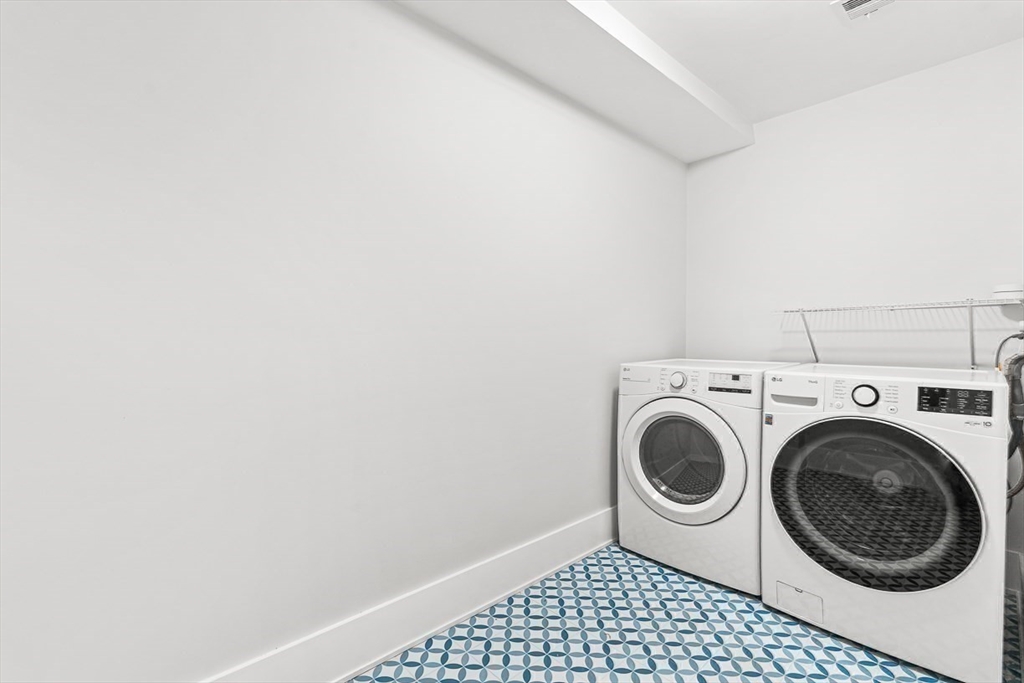 65 Summer Street, Unit 1 Natick, MA 01760 - Photo 17 of 21 a utility room with dryer and washer