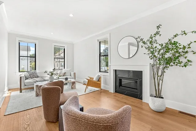 a kitchen with a table chairs sink and cabinets