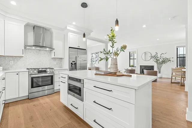 a bedroom with furniture and a large window