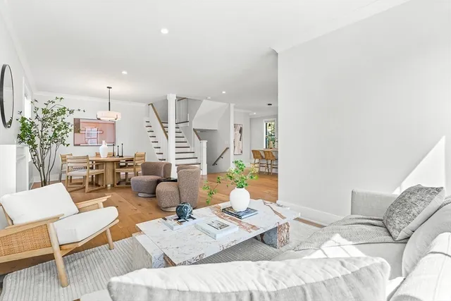 a dining room with furniture and wooden floor