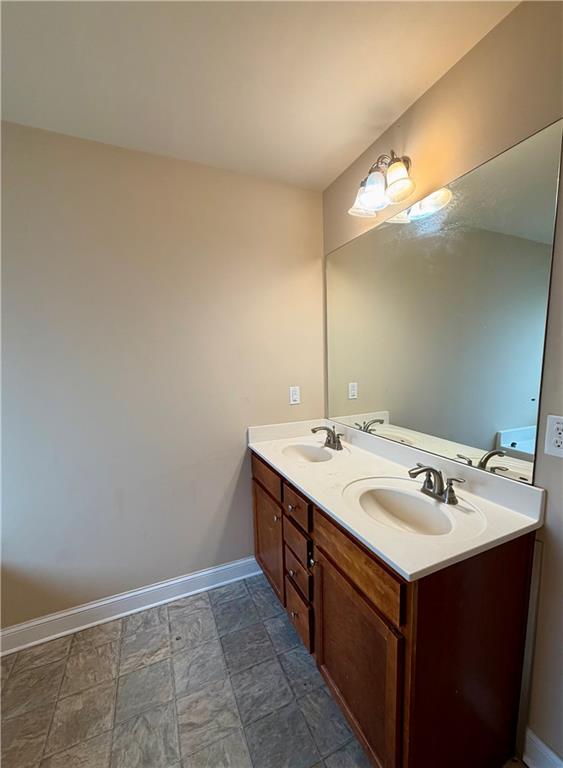 1985 Boatswain Drive Hampton, GA 30228 - Photo 14 of 14 a bathroom with a sink and a mirror